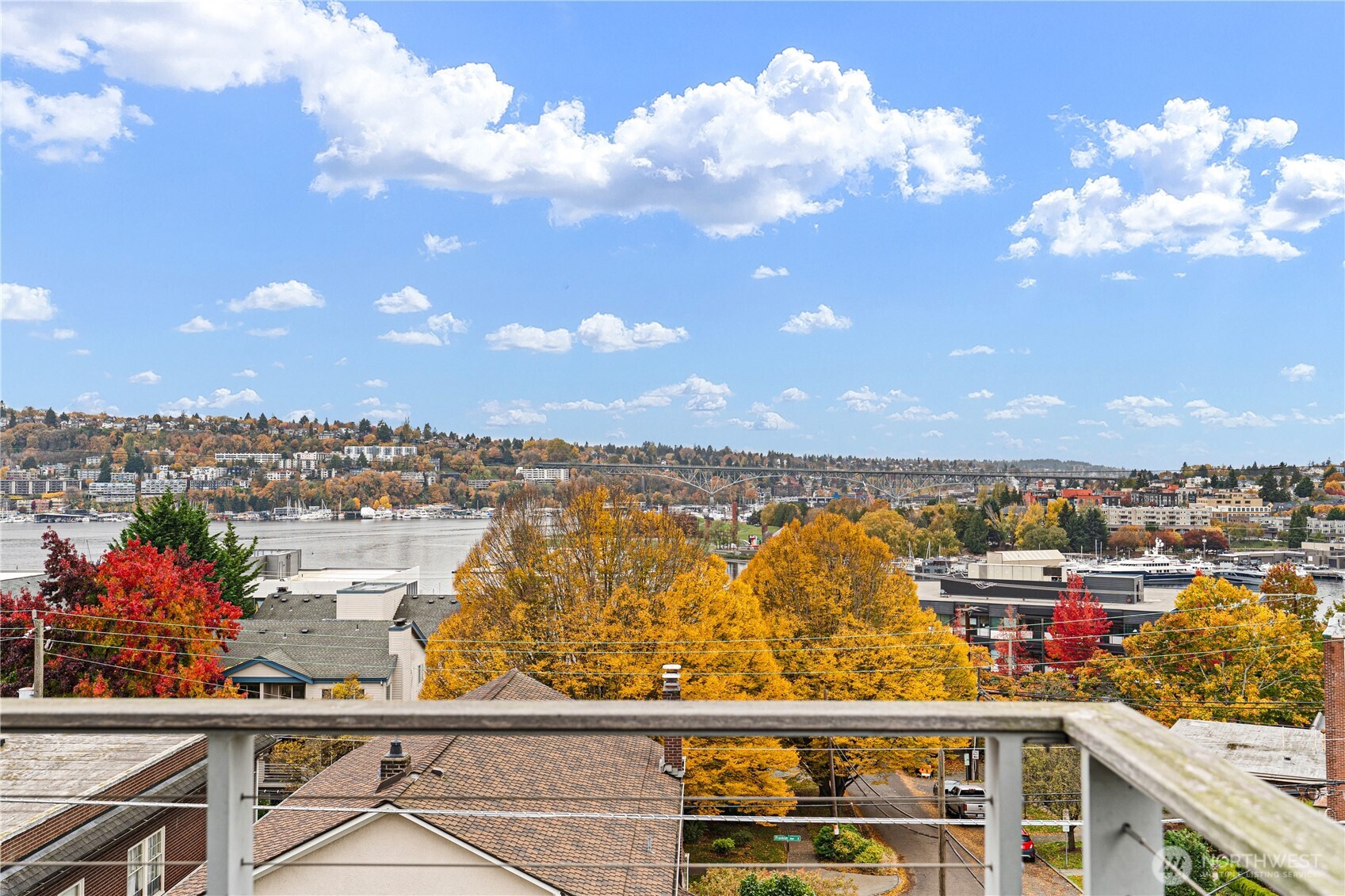 2731 Boylston Avenue East, Unit 300 Seattle, WA 98102 - Photo 32 of 36 a view of swimming pool with outdoor seating and city view