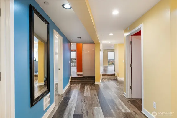 a view of a room with wooden floor and bedroom