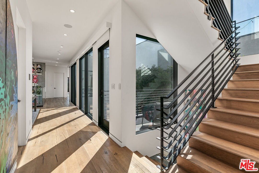 1060 Palms Boulevard Venice, CA 90291 - Photo 16 of 29 a view of a hallway with wooden floor and staircase