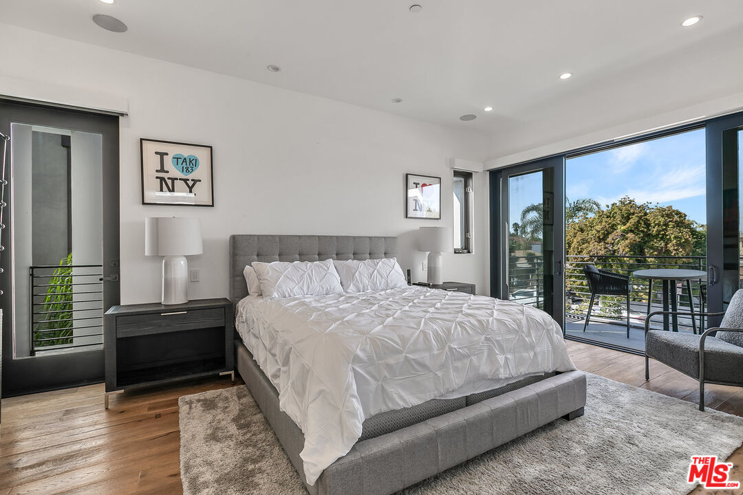 1060 Palms Boulevard Venice, CA 90291 - Photo 19 of 29 a bedroom with a bed and a large window