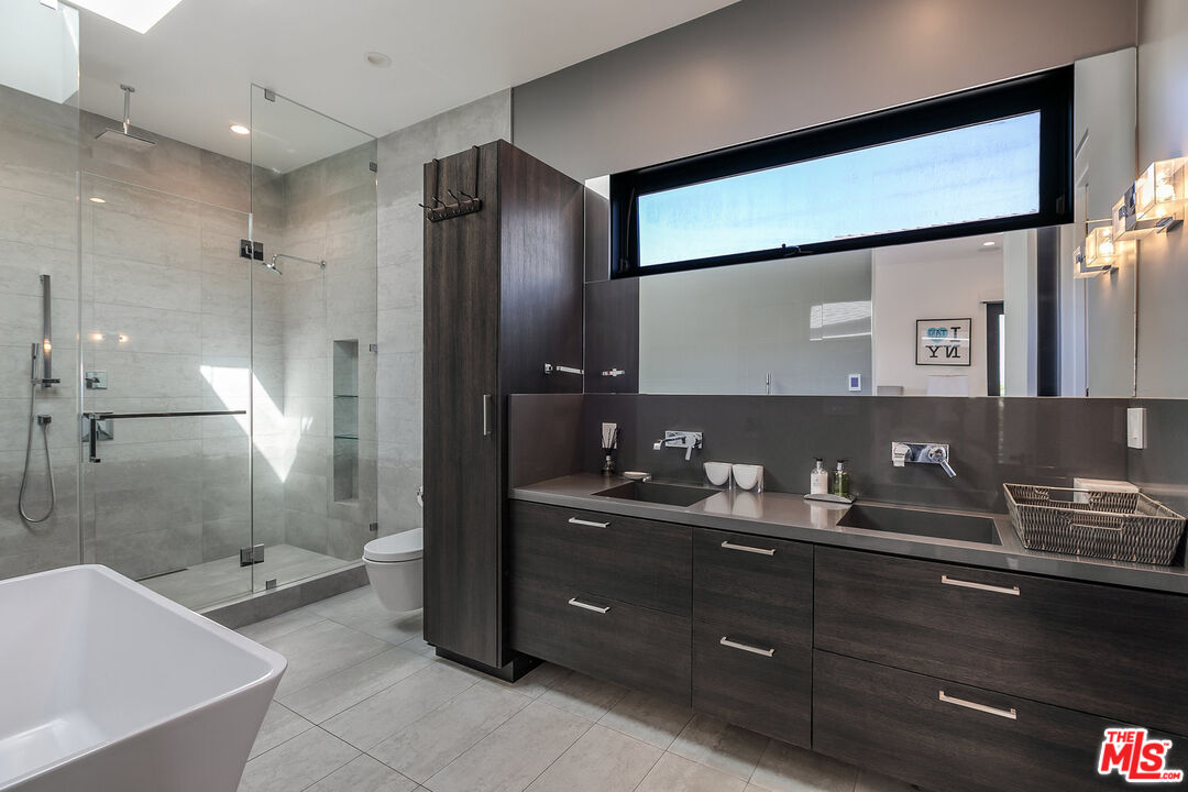 1060 Palms Boulevard Venice, CA 90291 - Photo 20 of 29 a bathroom with a granite countertop sink mirror and shower