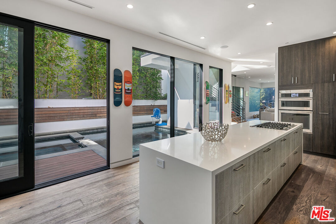 1060 Palms Boulevard Venice, CA 90291 - Photo 9 of 29 a kitchen with a stove a sink and a refrigerator