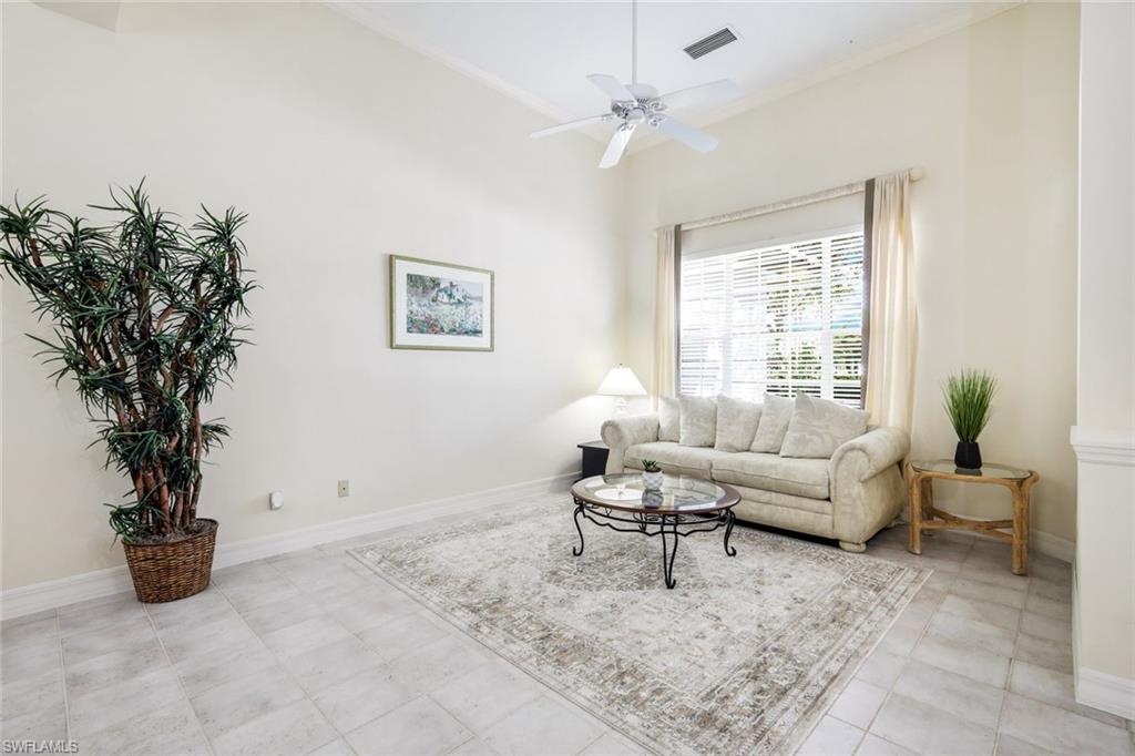 2451 Game Hawk Court, Unit 2502 Naples, FL 34105 - Photo 10 of 30 a living room with furniture and a potted plant