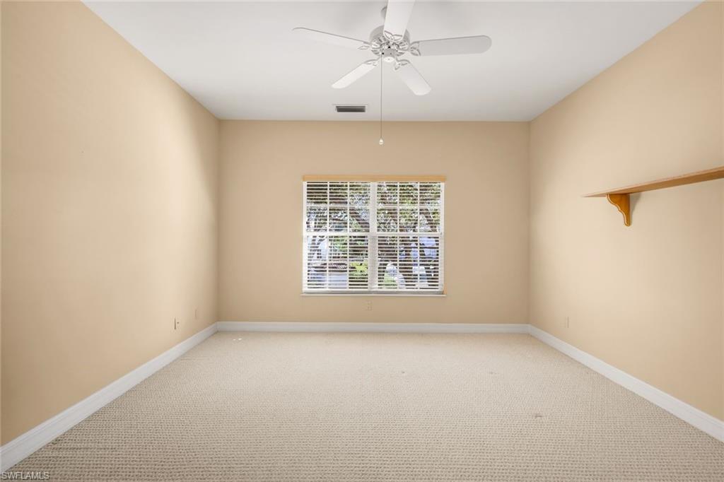 2451 Game Hawk Court, Unit 2502 Naples, FL 34105 - Photo 14 of 30 a view of an empty room with a window