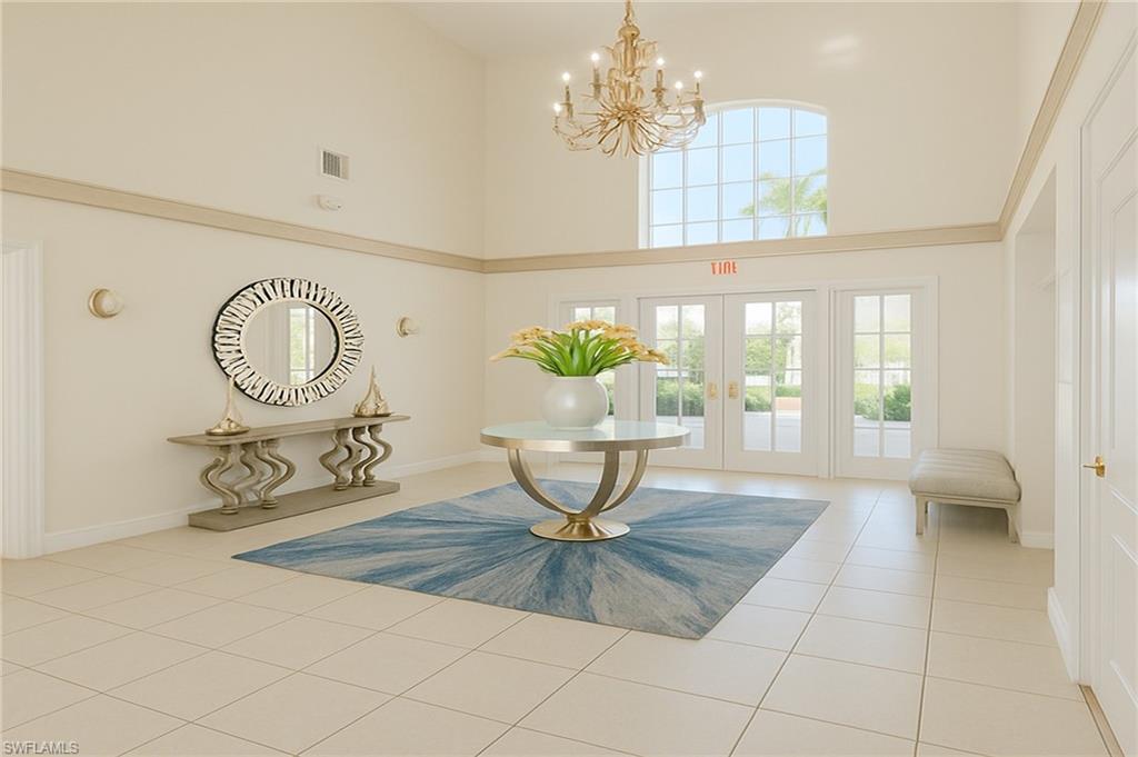 2451 Game Hawk Court, Unit 2502 Naples, FL 34105 - Photo 26 of 30 a view of a room with window and chandelier