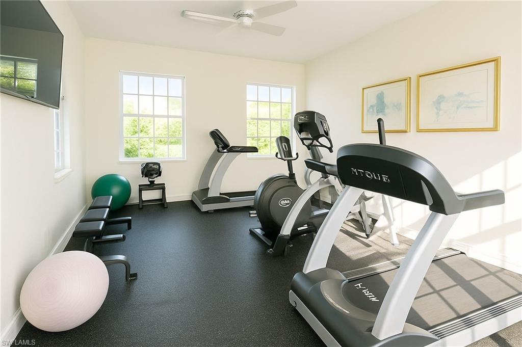 2451 Game Hawk Court, Unit 2502 Naples, FL 34105 - Photo 27 of 30 a bedroom with bed window and couch