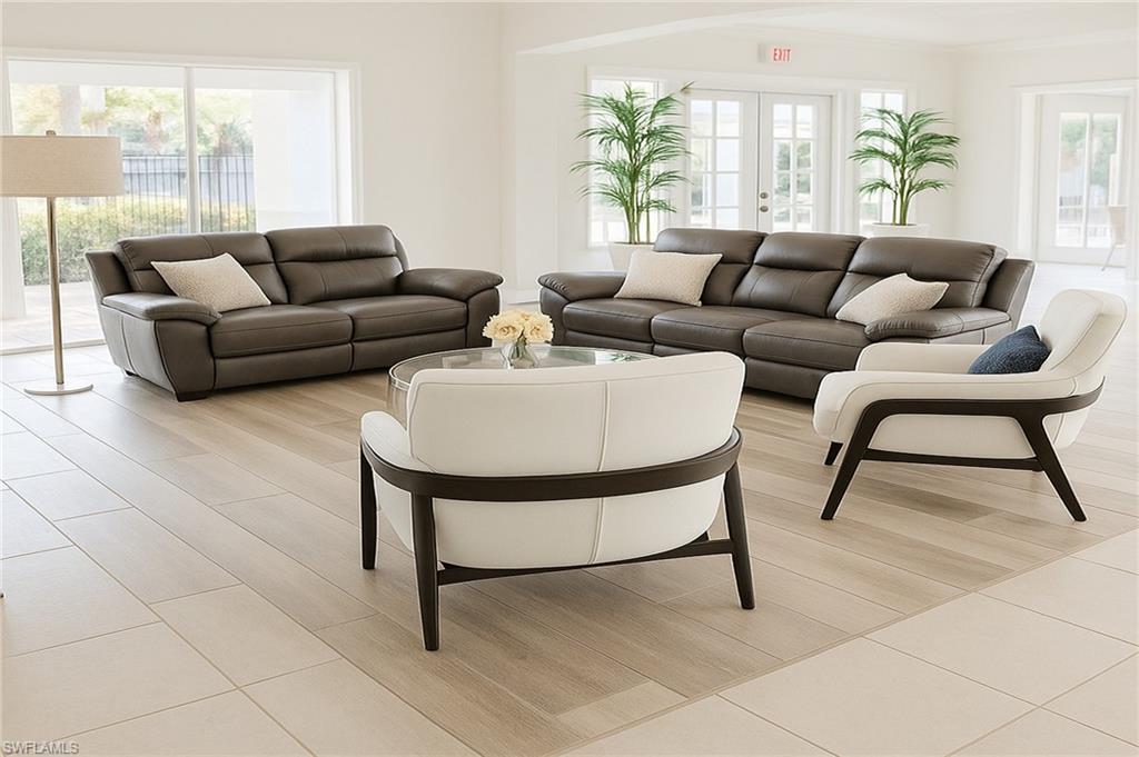 2451 Game Hawk Court, Unit 2502 Naples, FL 34105 - Photo 28 of 30 a living room with furniture and a large window