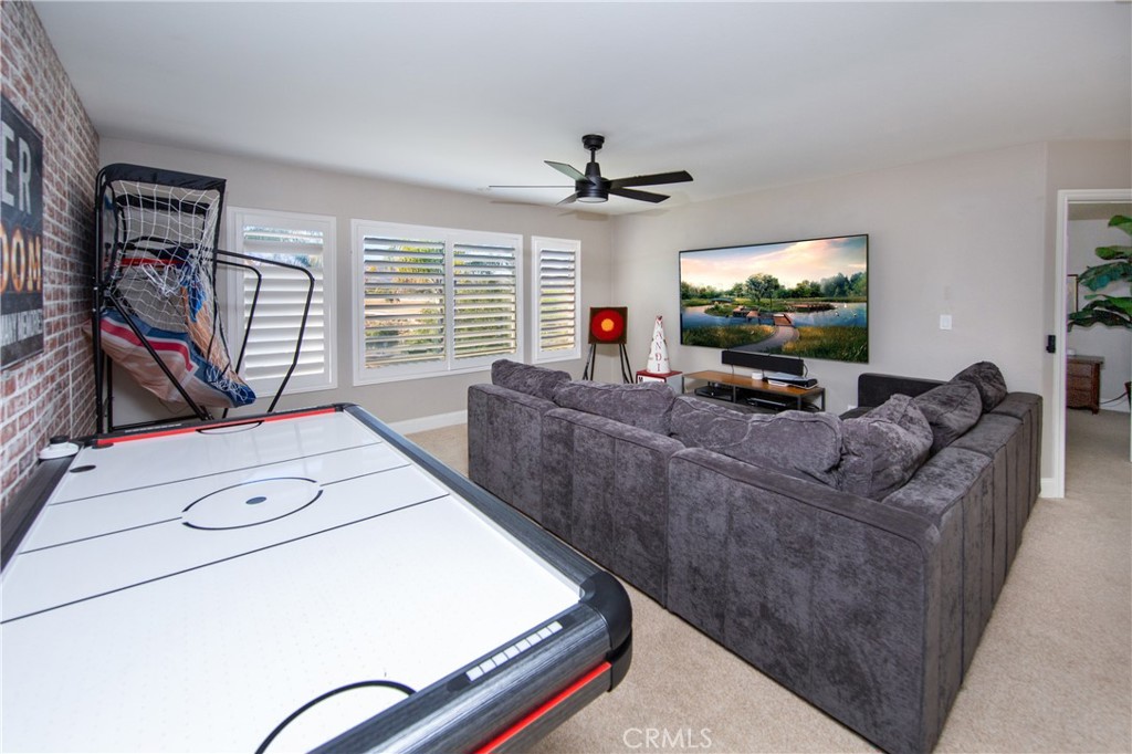 25313 Rolling Greens Way Saugus, CA 91350 - Photo 17 of 28 a living room with furniture and a flat screen tv