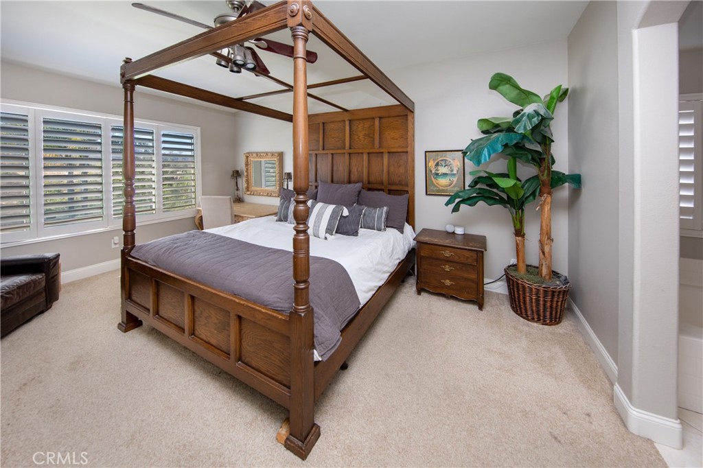 25313 Rolling Greens Way Saugus, CA 91350 - Photo 18 of 28 a bed room with a bed and a potted plant
