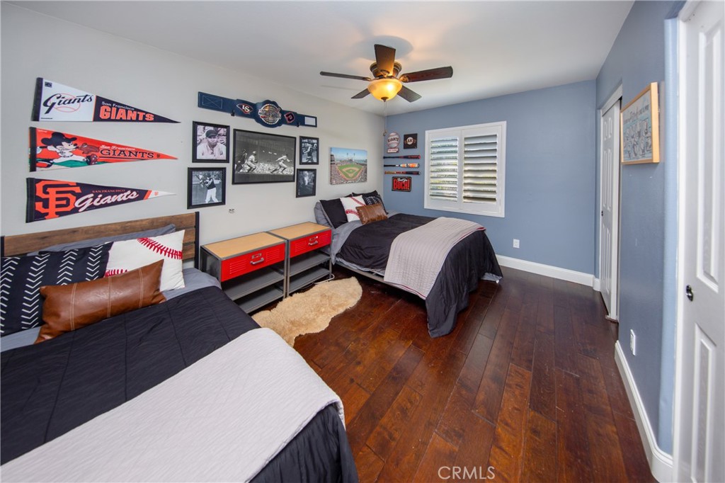 25313 Rolling Greens Way Saugus, CA 91350 - Photo 21 of 28 a bedroom with furniture and a wooden floor
