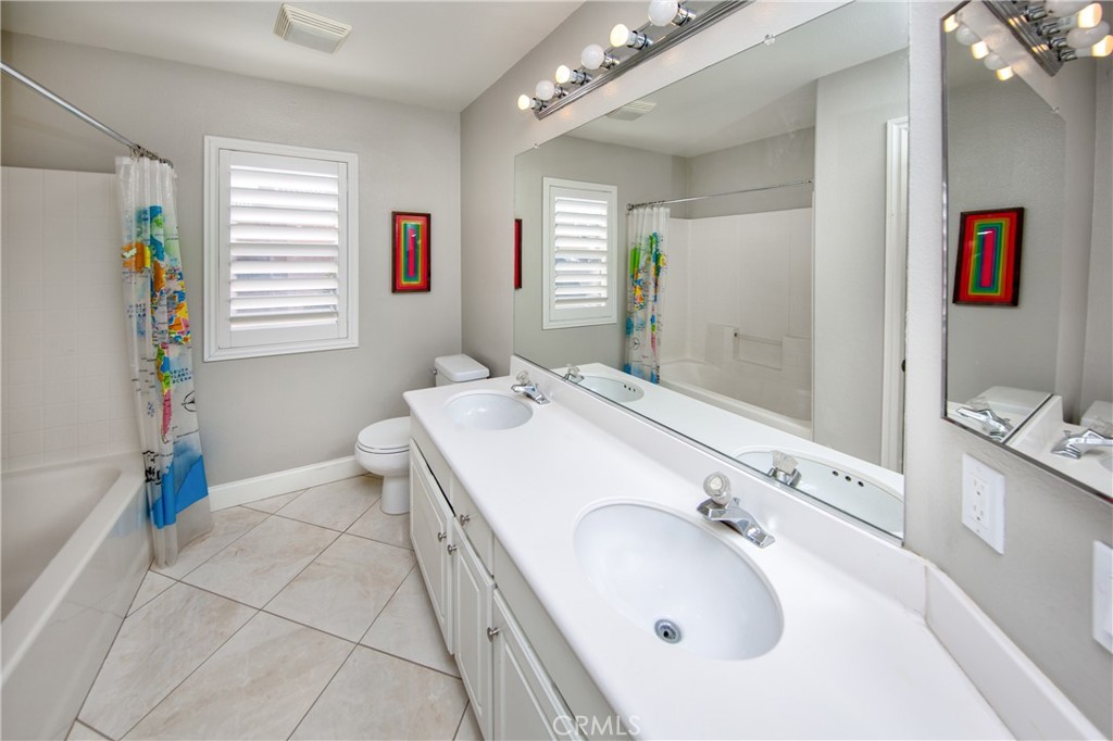 25313 Rolling Greens Way Saugus, CA 91350 - Photo 22 of 28 a spacious bathroom with a tub sink and mirror
