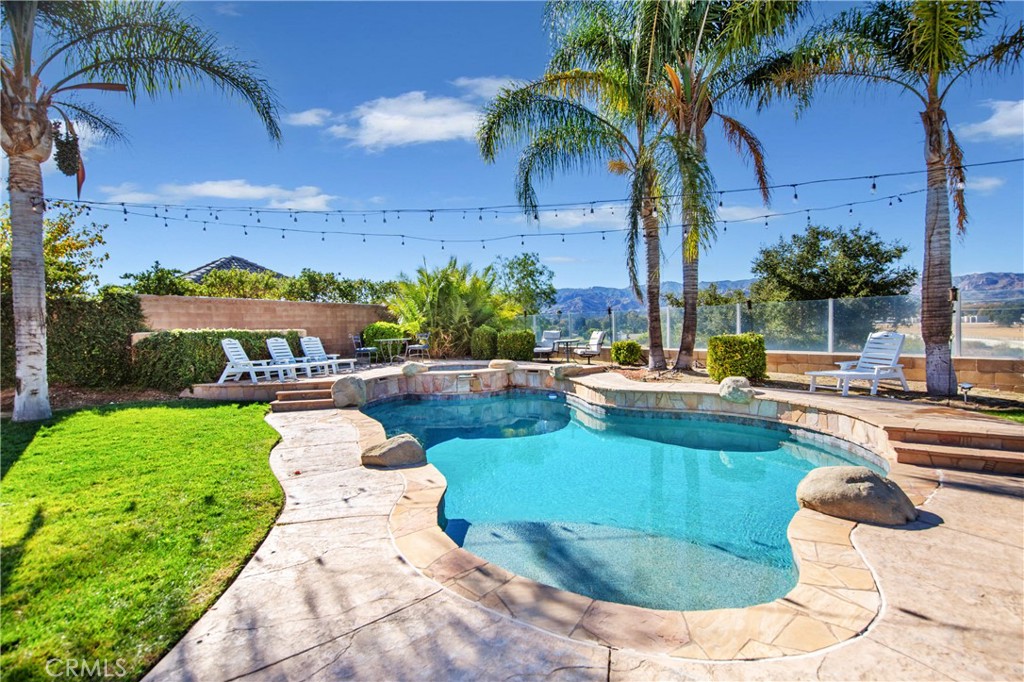 25313 Rolling Greens Way Saugus, CA 91350 - Photo 26 of 28 a view of a swimming pool with a patio