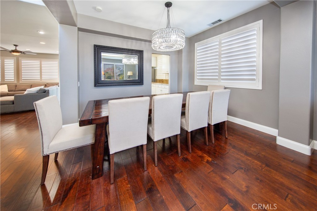 25313 Rolling Greens Way Saugus, CA 91350 - Photo 7 of 28 a view of a dining room with furniture window and wooden floor