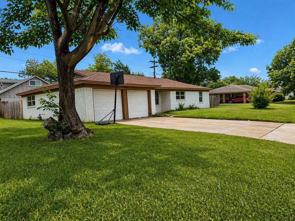 812 Irwin Drive Hurst, TX 76053 - Photo 1 of 16 Single-story residence featuring a white brick exterior and a two-car garage