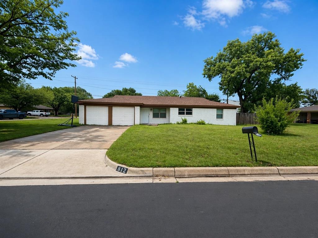 812 Irwin Drive Hurst, TX 76053 - Photo 2 of 16 Single-story residence featuring a white brick exterior and a brown roof