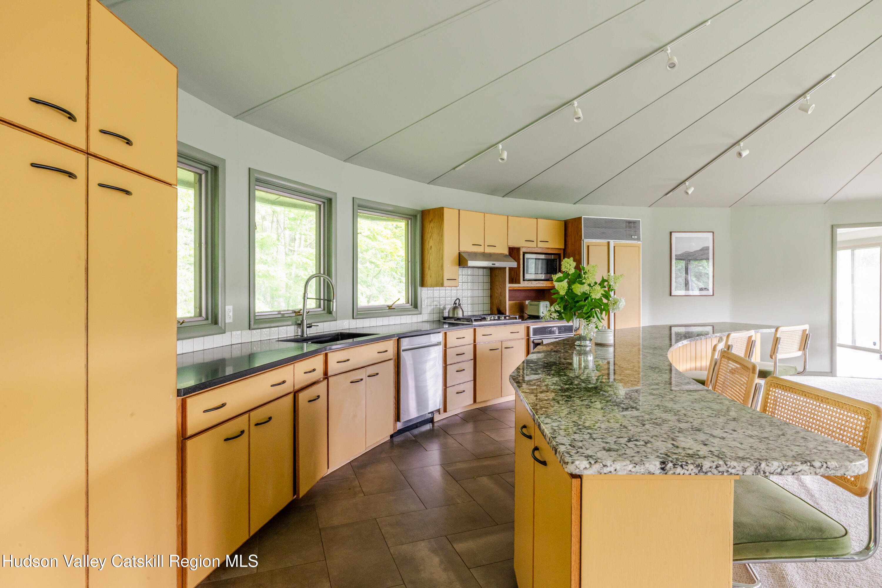 407 Mill Street Windham, NY 12496 - Photo 11 of 39 a kitchen with stainless steel appliances granite countertop sink stove and cabinets