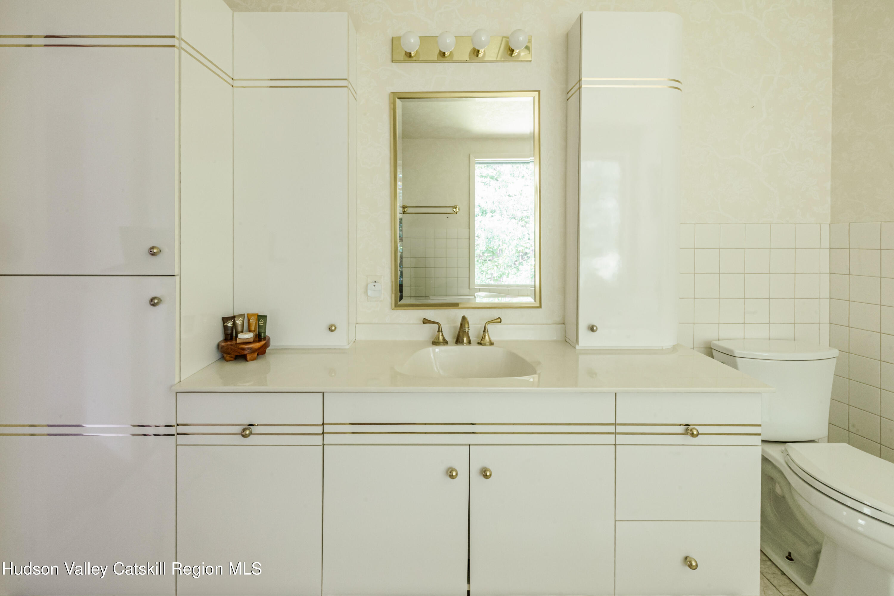 407 Mill Street Windham, NY 12496 - Photo 18 of 39 a bathroom with a sink and a mirror