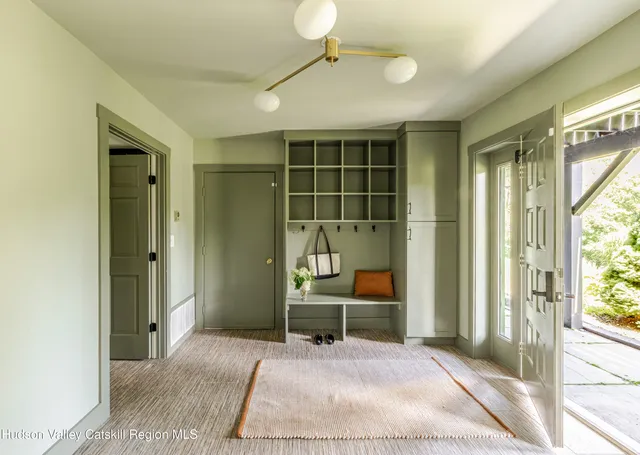 a view of a room with table and a window