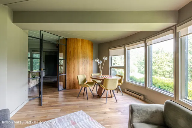a bathroom with a shower and a mirror