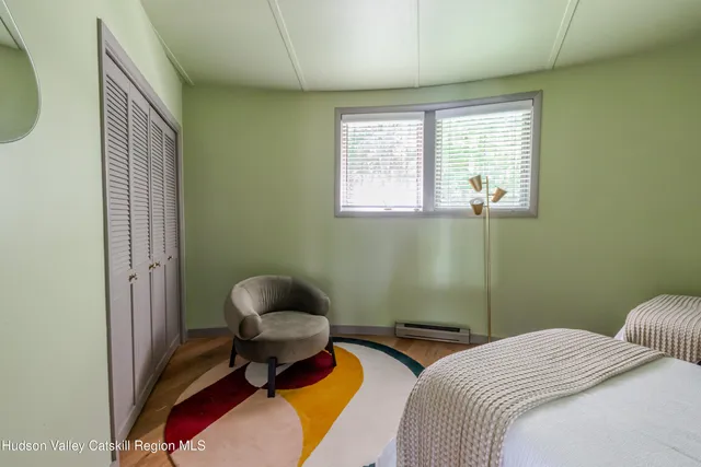 a view of a room with window and stairs