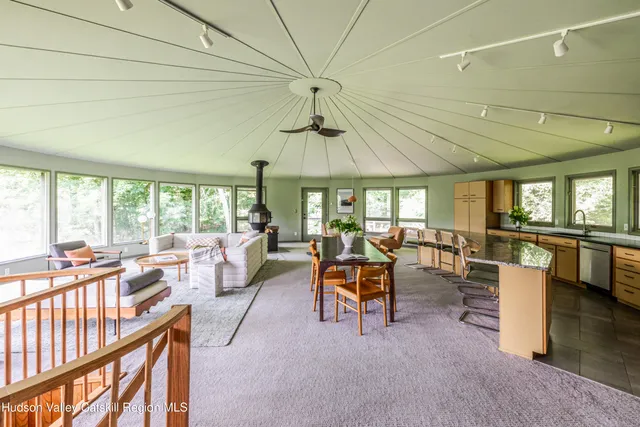 a view of a dining room with furniture window and outside view