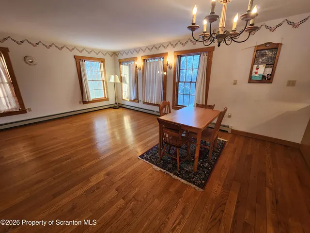 a room with wooden floor and window
