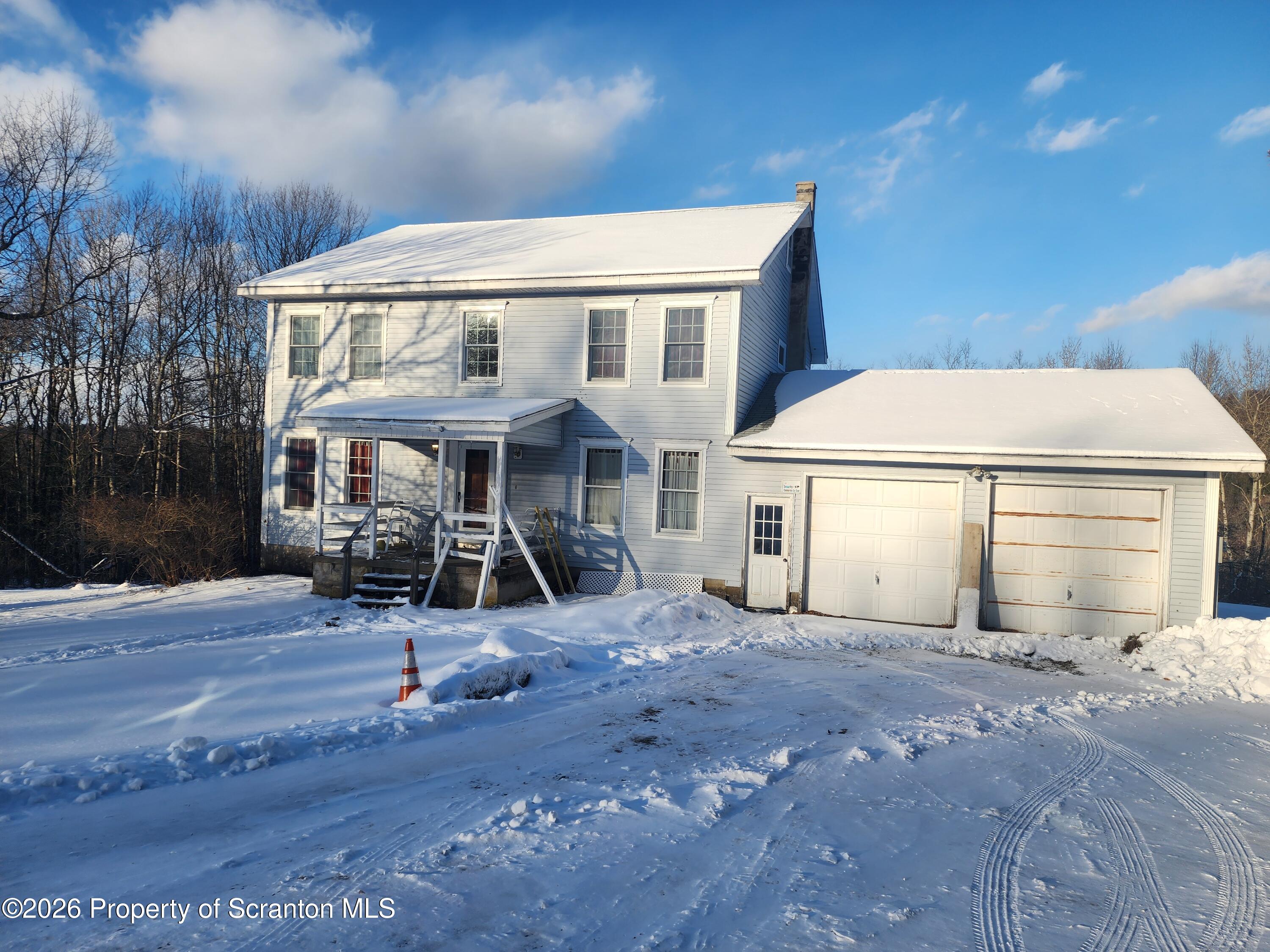 648 Dundaff Street Carbondale, PA 18407 - Photo 2 of 35 a front view of a house with a yard
