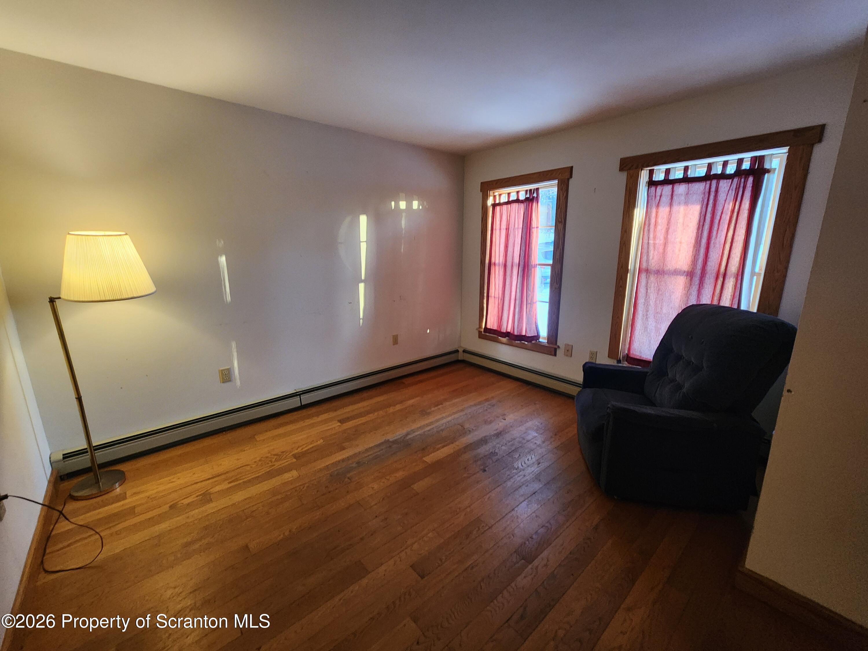 648 Dundaff Street Carbondale, PA 18407 - Photo 22 of 35 a living room with furniture and a window