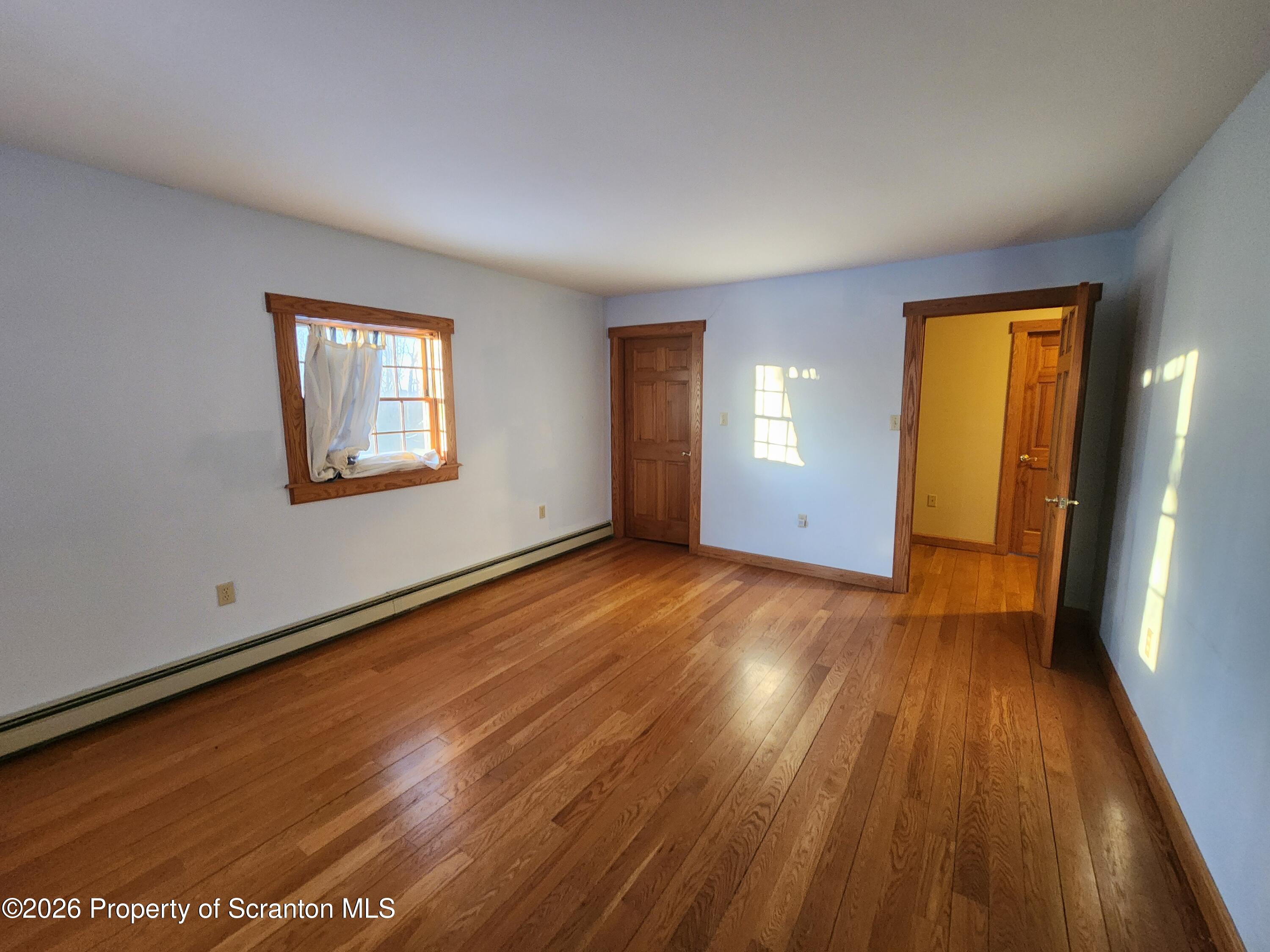 648 Dundaff Street Carbondale, PA 18407 - Photo 29 of 35 a view of a room with wooden floor and a window