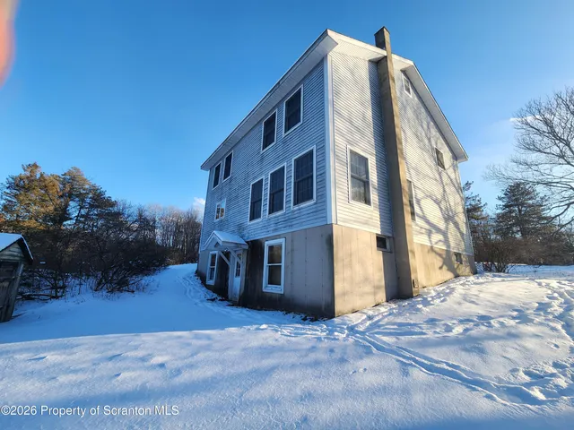 a view of a building with a yard