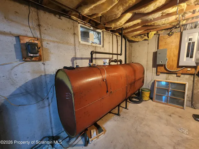 a bed room with a bed and a television