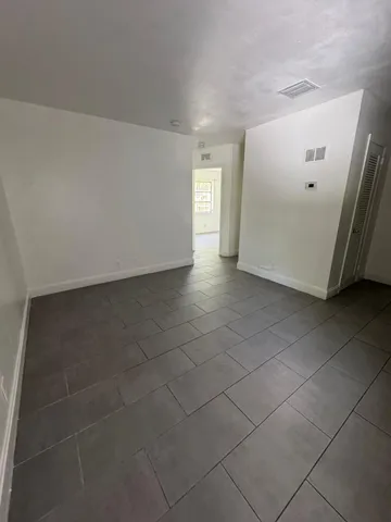 a view of an empty room and window