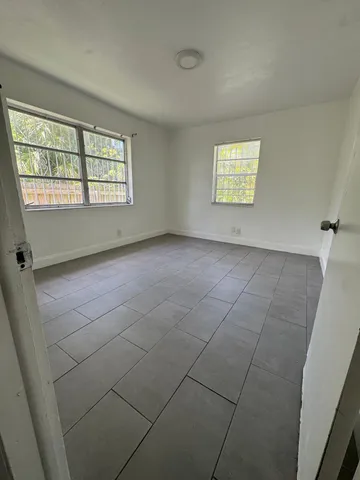 a view of an empty room with a window