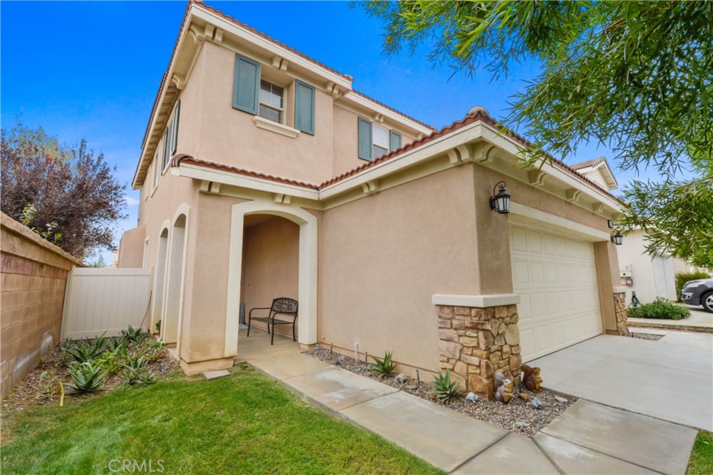 1681 Rigel Street Beaumont, CA 92223 - Photo 1 of 1 a front view of a house with garden