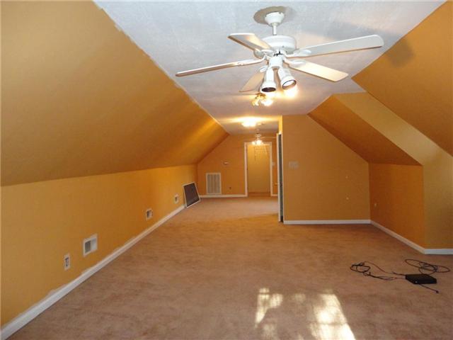 599 Parsons Road Christiana, TN 37037 - Photo 14 of 20 43x15 upstairs room with closet, ceiling fan, and extra storage space