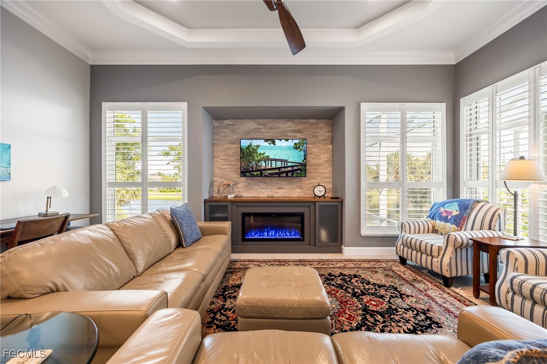 710 Birdie View Point Sanibel, FL 33957 - Photo 18 of 50 a living room with furniture fireplace and a large window