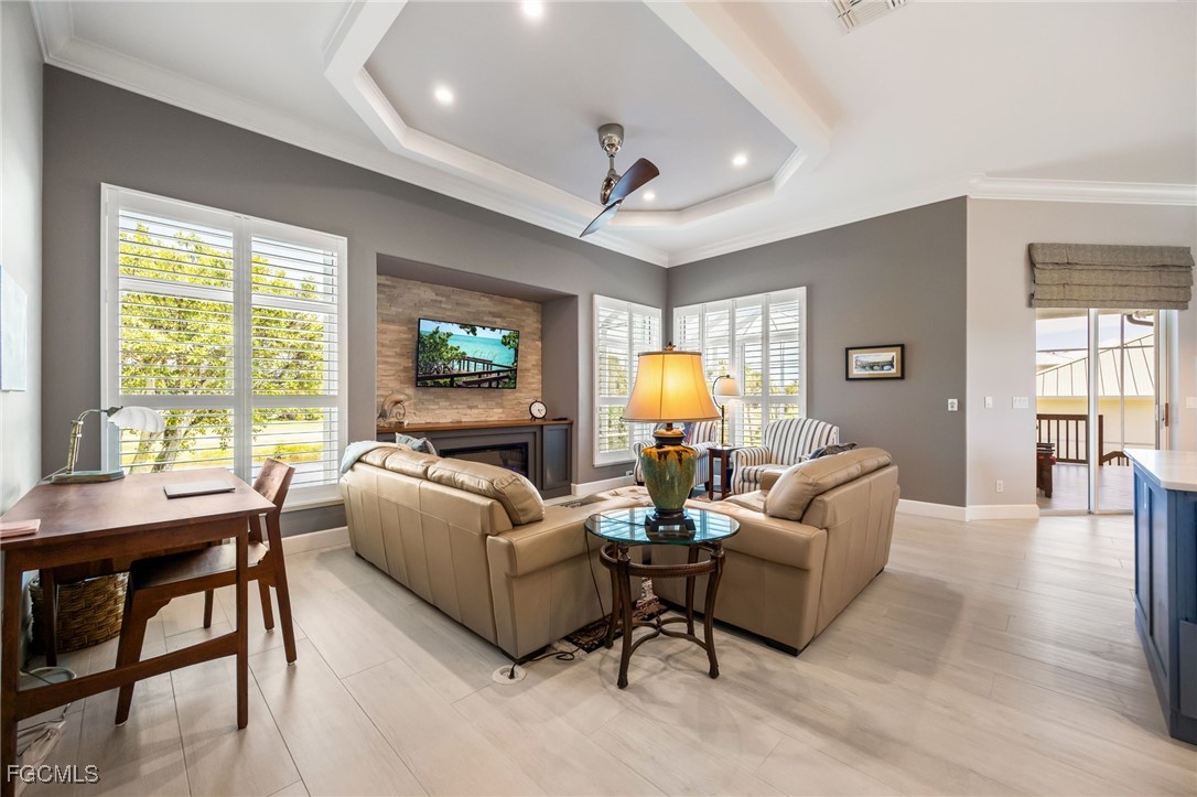 710 Birdie View Point Sanibel, FL 33957 - Photo 19 of 50 a living room with furniture a table and a large window