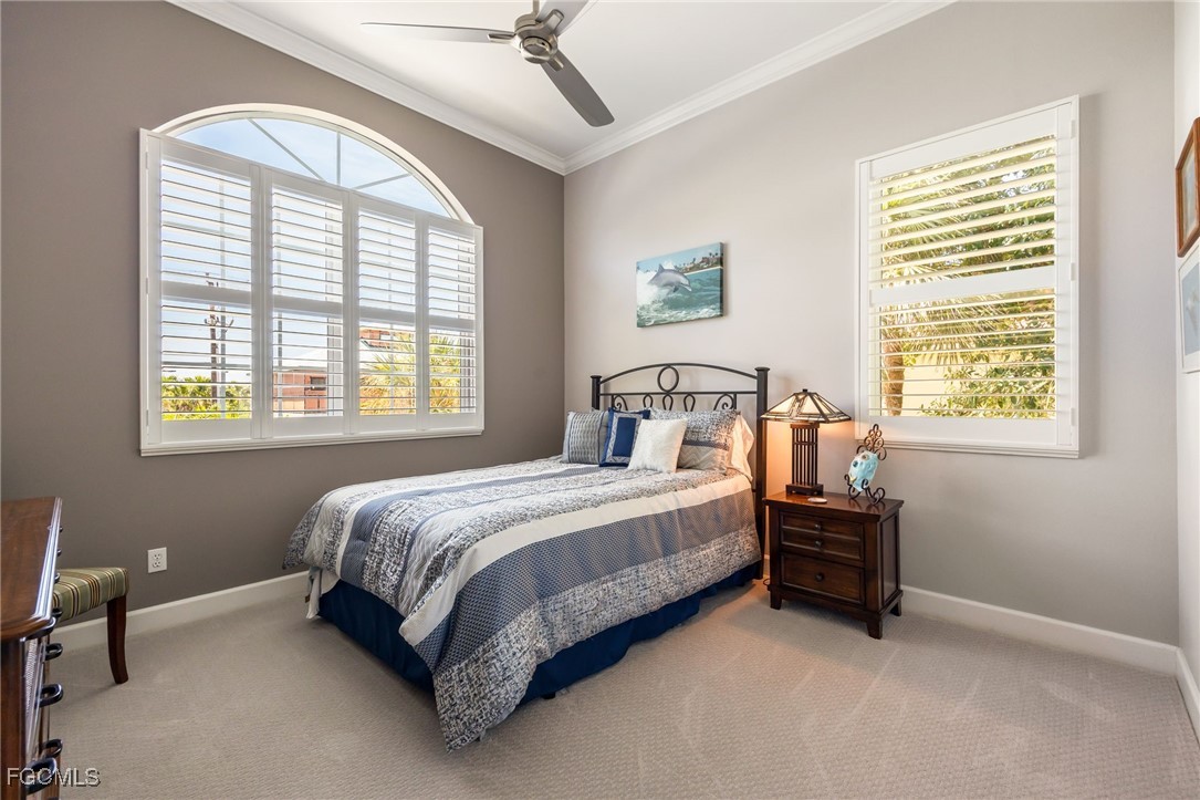 710 Birdie View Point Sanibel, FL 33957 - Photo 25 of 50 a bed sitting in a bedroom next to a window