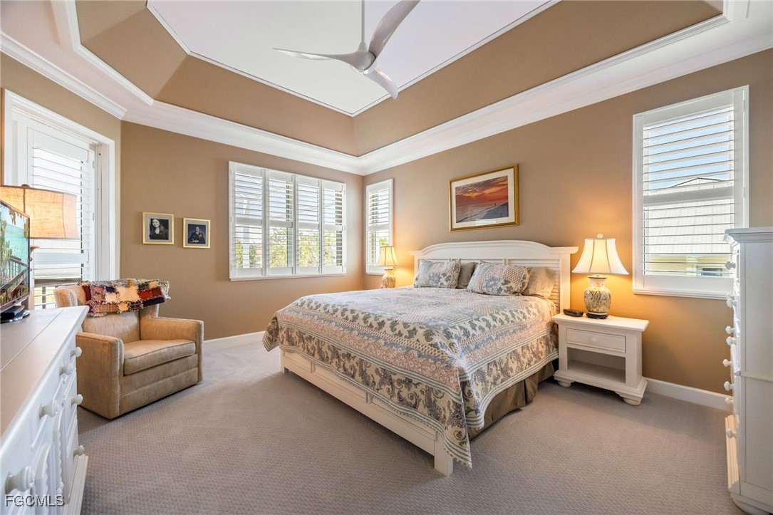 710 Birdie View Point Sanibel, FL 33957 - Photo 29 of 50 a spacious bedroom with a bed and a couch