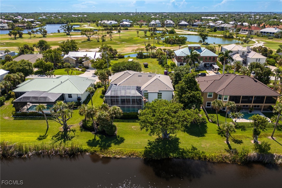 710 Birdie View Point Sanibel, FL 33957 - Photo 50 of 50 an aerial view of a house with a lake view