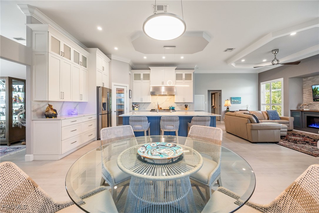 710 Birdie View Point Sanibel, FL 33957 - Photo 9 of 50 a view of a dining room with furniture and a chandelier