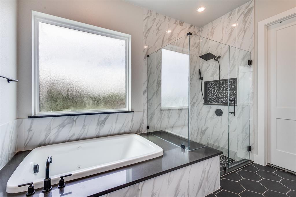 2255 County Road 377 Van Alstyne, TX 75495 - Photo 16 of 35 a bathroom with a tub and a shower
