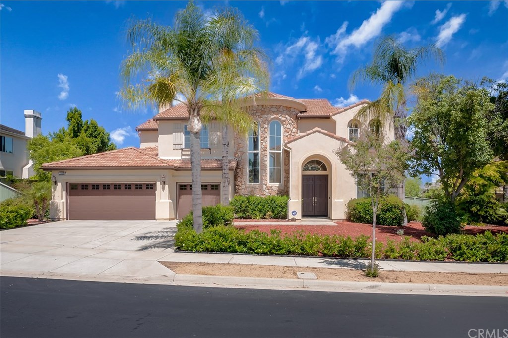 17305 Sunrise Ridge Drive Riverside, CA 92503 - Photo 1 of 1 a front view of a house with a garden