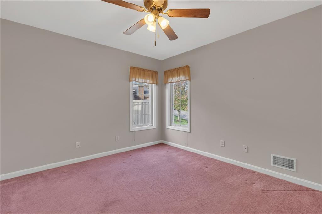 116 Windcrest Court Beaver Falls, PA 15010 - Photo 12 of 26 an empty room with windows and chandelier fan