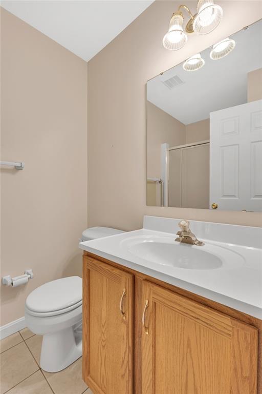 116 Windcrest Court Beaver Falls, PA 15010 - Photo 14 of 26 a bathroom with a granite countertop sink a toilet and a mirror