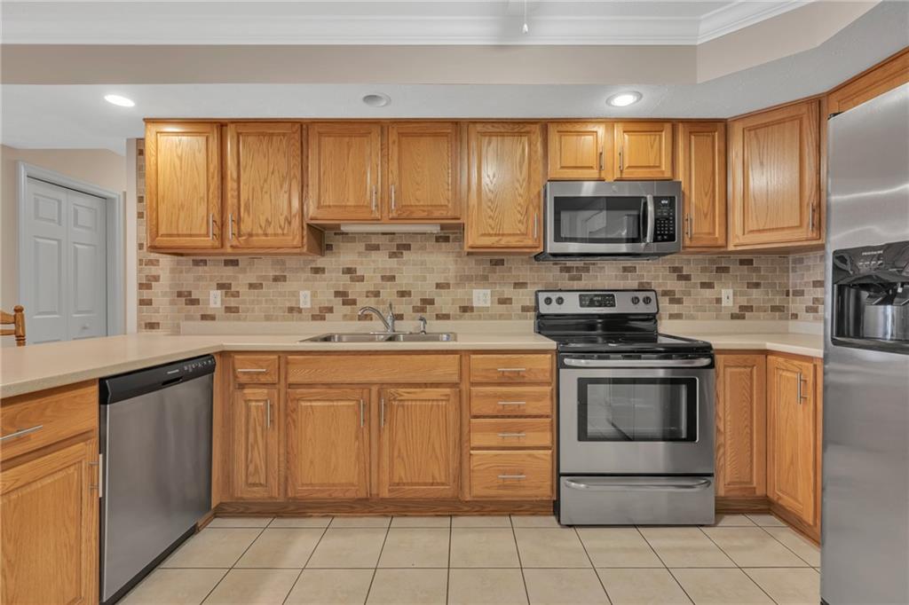 116 Windcrest Court Beaver Falls, PA 15010 - Photo 2 of 26 a kitchen with stainless steel appliances granite countertop a stove sink microwave and refrigerator
