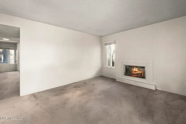 a view of an empty room and closet area