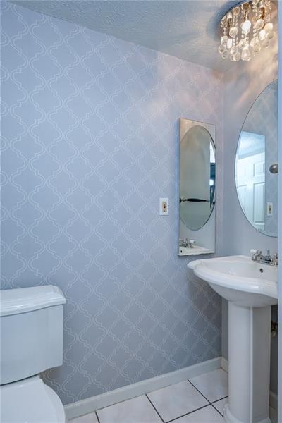 402 Three Degree Road Renfrew, PA 16053 - Photo 13 of 25 Well appointed updated powder room just off the kitchen.