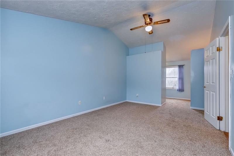 402 Three Degree Road Renfrew, PA 16053 - Photo 14 of 25 Enormous 23x11 master suite with cathedral ceilings, multiple closets, ceiling fan, vanity, & ensuite.