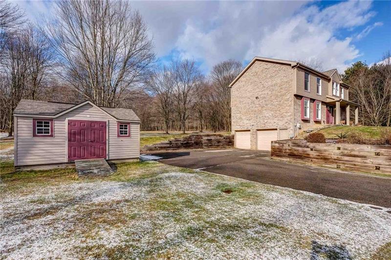 402 Three Degree Road Renfrew, PA 16053 - Photo 24 of 25 Increase your storage space with the matching large shed. The big double garage measures 23x22.